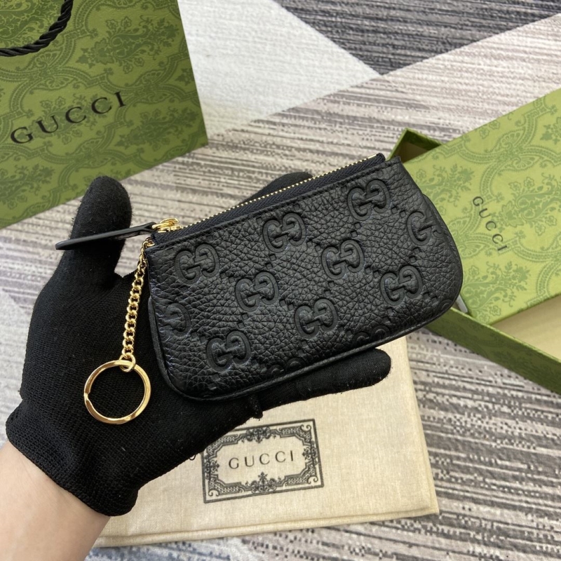 G*u*i clutch bags